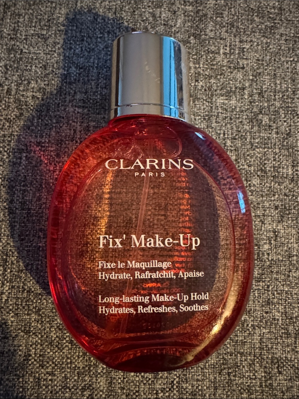 Clarins Fix' Make-Up Setting Mist in Translucent Red Bottle